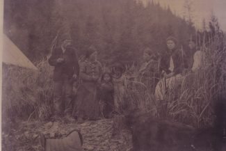 Mary Lowell's family on the beach at Resurrection Bay. From left to right: Son William Lowell, his wife and two children, Mary, and two of her daughters, Eva and most likely, Alice. Photo courtesy Resurrection Bay Historical Society, 20.1.1.