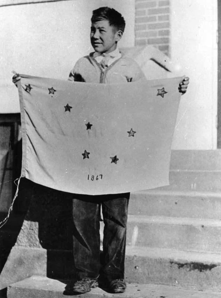 Benny Benson holding the Alaska flag at the Jesse Lee Home, Seward, Alaska. ASL-P01-1921, Alaska State Library-Historical Collections.