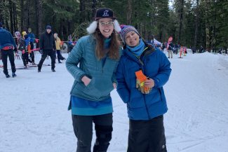 Deb Essex, race director of the KMTA Classic in Girdwood, Alaska and Amanda Sassi take a moment to smile for the camera.